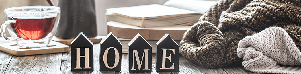 Home house blocks with blankets and cup of tea.